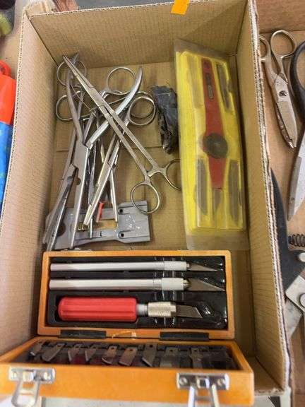 Box of hemostats, exacto knife and snips image