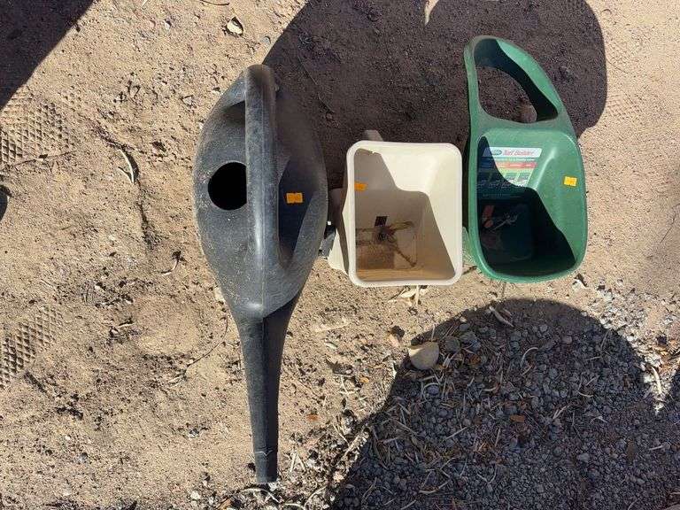 Two seed speeders and watering can image