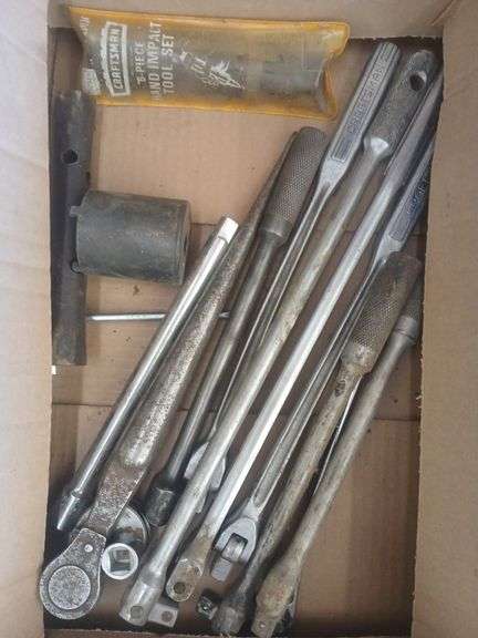 Box of breaker bars and ratchets. image