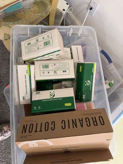 Two tubs of bathroom stuff image