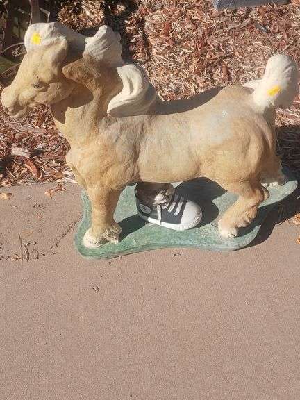 Horse and puppy in a shoe stone yard decoration image