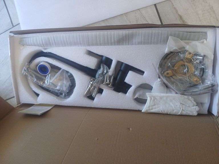 Kitchen faucet in box. image