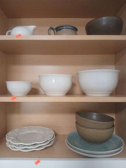 Glass kitchen supplies, bowls and plates. Shelf contents. image