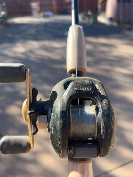 Bass pro shop open face reel and rod. image