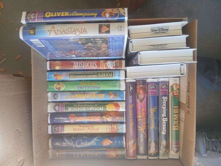 Box of Disney vhs tapes and box of misc movies. image