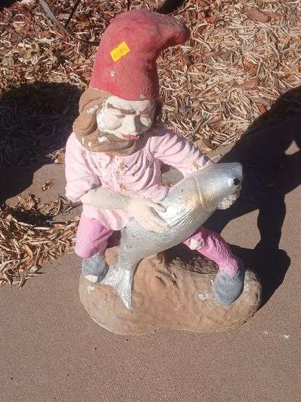 Gnome holding a fish stone yard decoration image