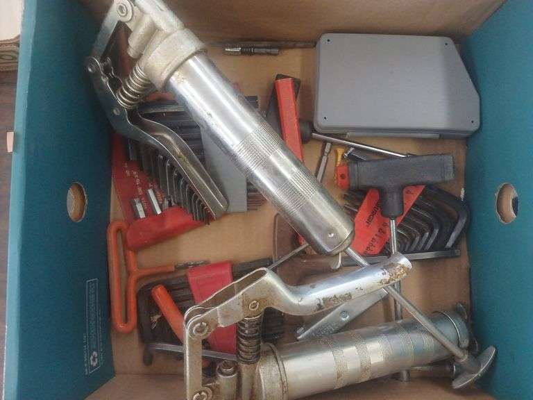 Box of Alan wrenches and two grease guns image