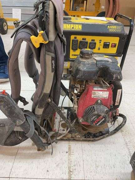 Gas powered backpack post hole digger. image