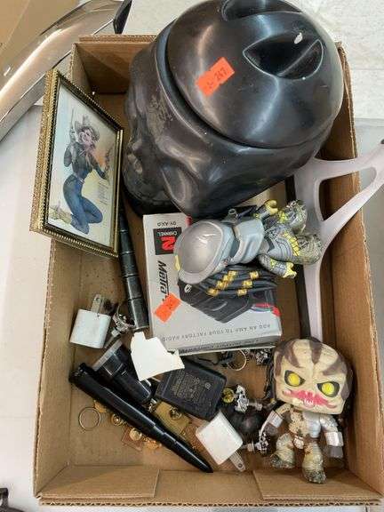 Box of miscellaneous. Glass skull, pinup girl picture and other small items image