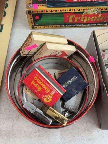 Metal tins, matches and flint lighters image
