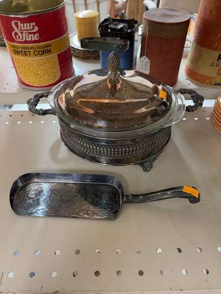 silver-plated casserole dish with a Pyrex glass insert and table crumber image