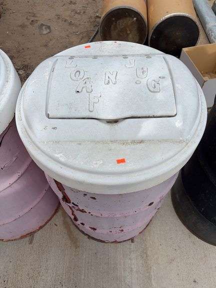 Barrel with lid filled with aluminum cans image