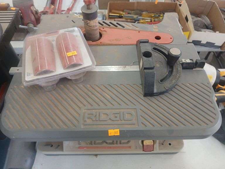 Rigid table with spare sand paper image