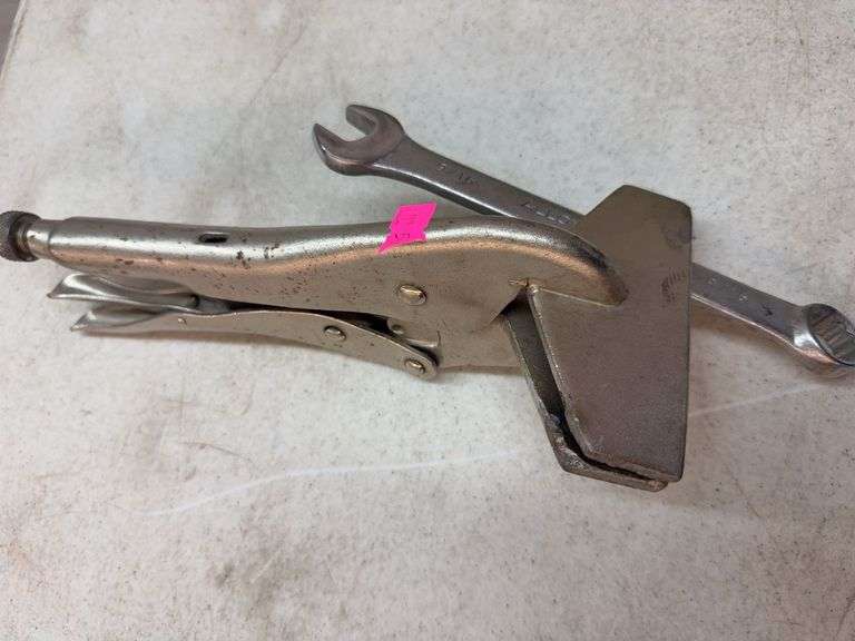 Vise grips with 9/16” wrench image