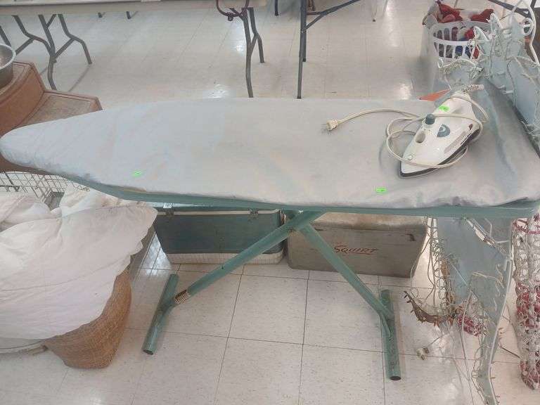 Ironing table with iron. image