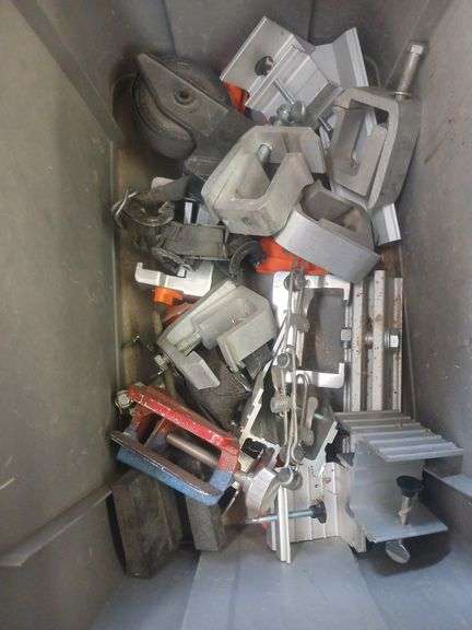 Bin of metal clamps image