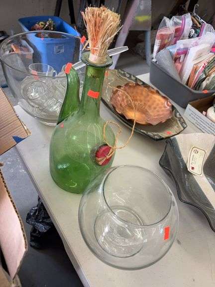 Green bottle and small fish bowl image