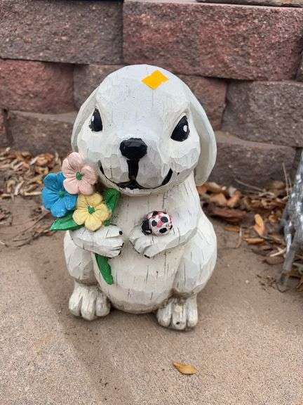 Bunny holding flowers wooden yard decoration image