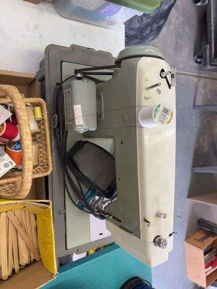 Sears Kenmore sewing machine with pedal and a box of craft supplies image