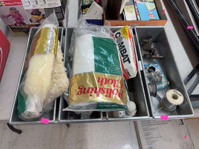 Miscellaneous items in metal bin image