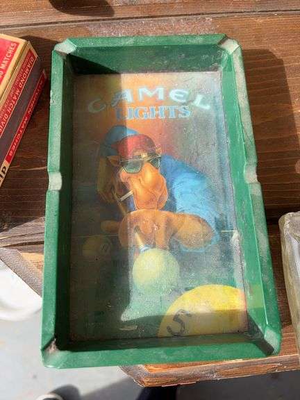 2 ashtrays 1 box of matches image
