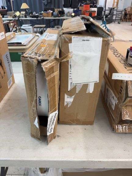 Two boxes of raised toilet seats image