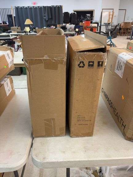 Two boxes of raised toilet seats image