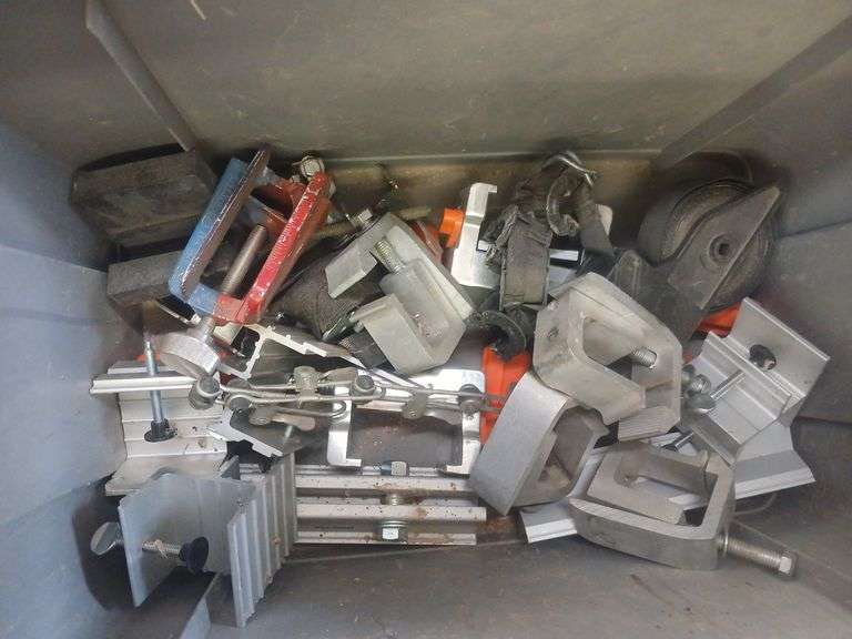 Bin of metal clamps image