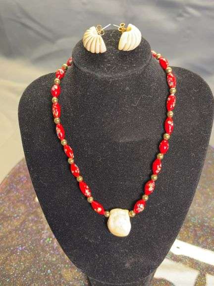 Beaded necklace with ivory pendant, and ivory earrings image