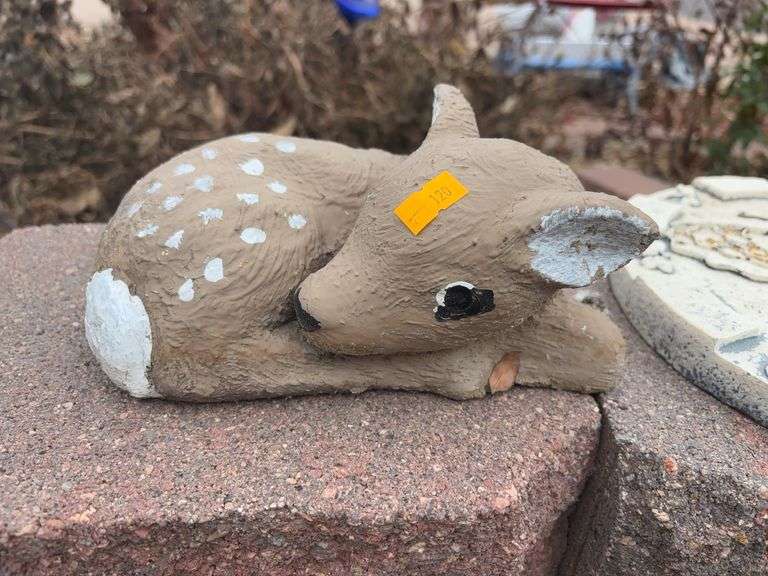 Deer laying down stone yard decoration image