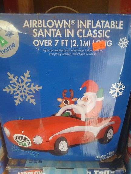 Inflatable Santa in classic car image