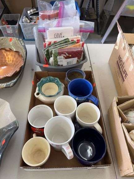Coffee cups and box of napkins image