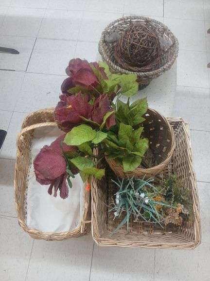 Wooden baskets and fake plants. image