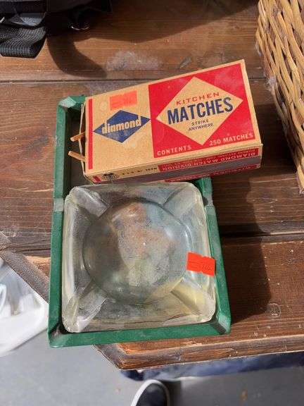 2 ashtrays 1 box of matches image