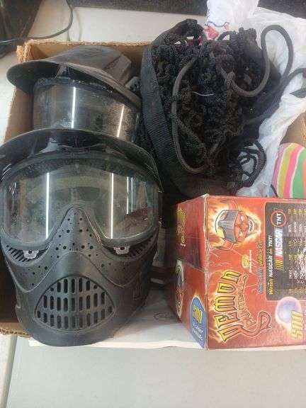 2 paintball masks paintballs net and Frisbee image