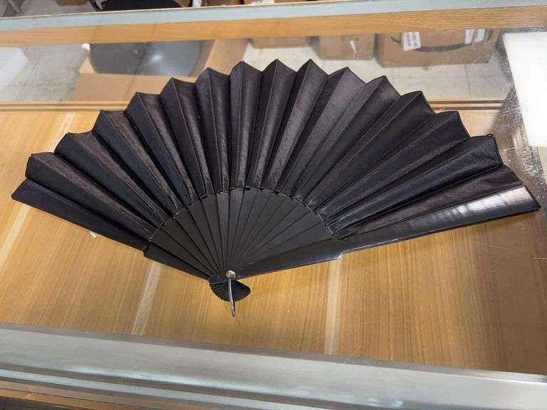 Black holding fan image