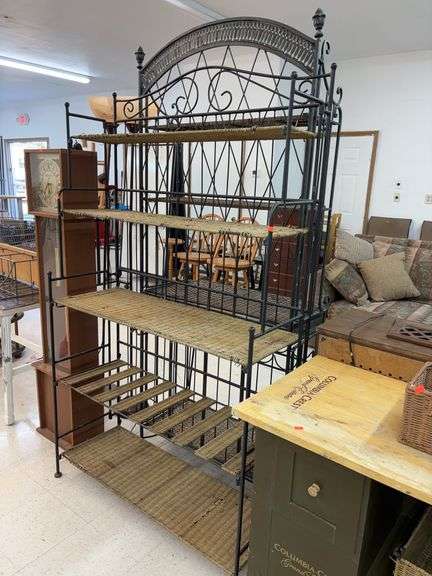 Wrought iron baker's rack with wicker image