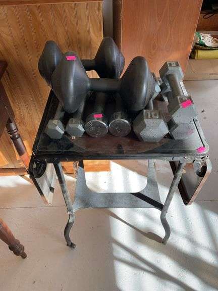 Assortment of weights and small folding metal table image