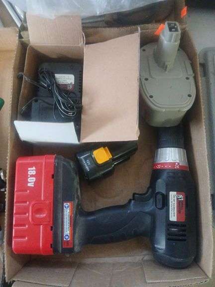 Flat with drill and misc drill batteries image