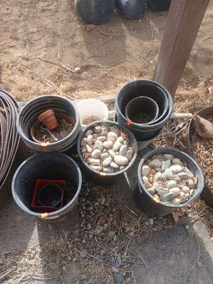 10 black nursery pots. image