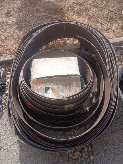 Brown Yard edging with stakes. image