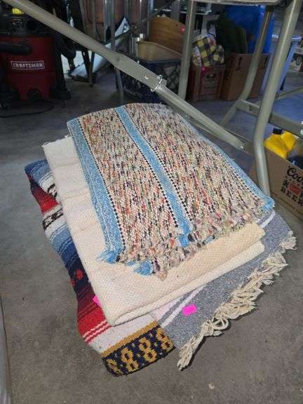 Lot of tarps, blankets, and rugs image