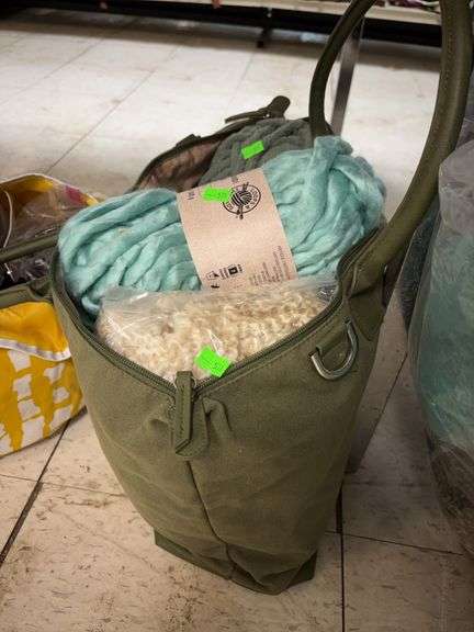 Green bag of yarn image