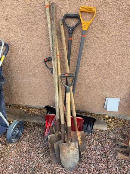 Collection of hand tools  shovels, snow shovels image