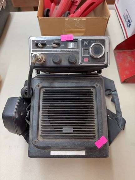 CB radio unit with an attached external speaker and microphone and antenna image