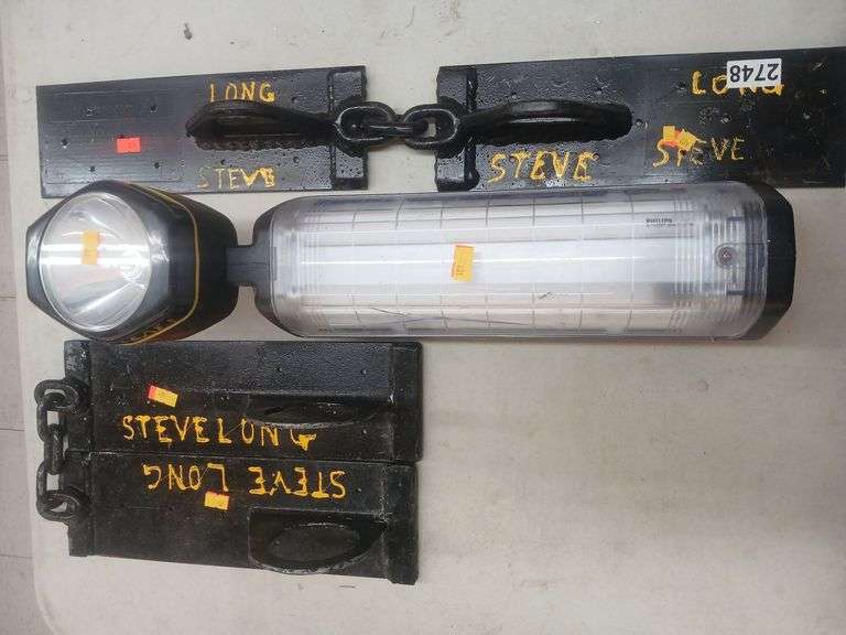 Hanging light/radio and 2 metal plates. image