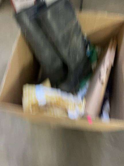 Box of blankets, rubber boots, and a keyboard image