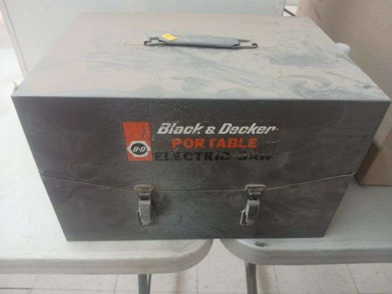 Black and decker portable saw and metal wall cabinet. image