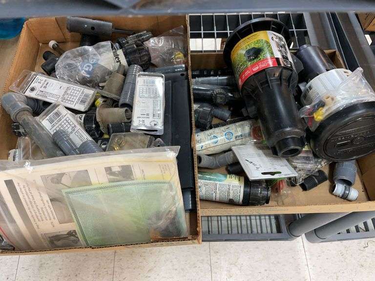 Two boxes of various sprinkler system components image