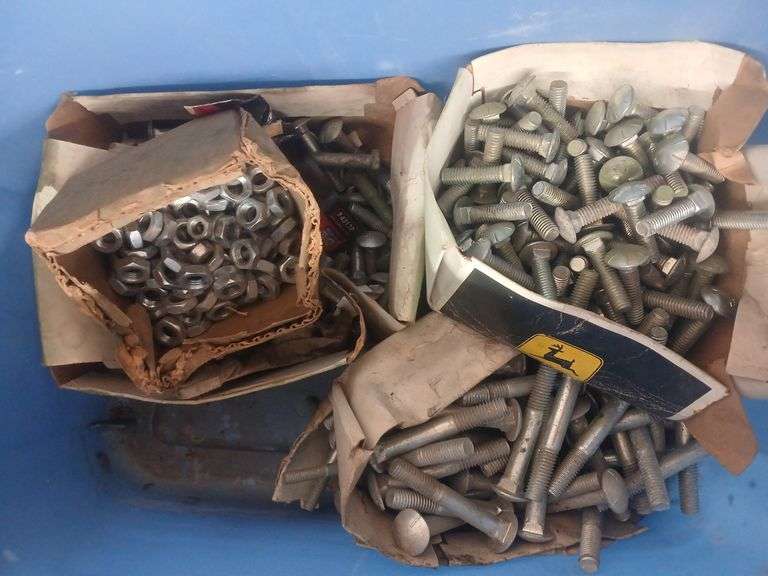 Bin of miscellaneous John Deere bolts and nuts. image
